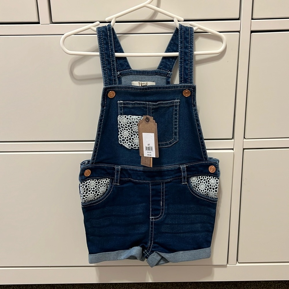 Size 2T Toddler girl denim overalls with crochet appliqué on pockets